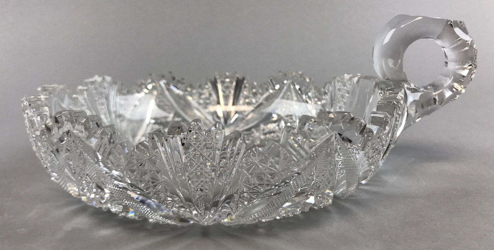 American Brilliant Period Pitkin and Brooks Cut Glass: 7 1/4 x 6 inches. Crosshatch fan pattern w/ sawtooth rim; wear and chips consistent with age