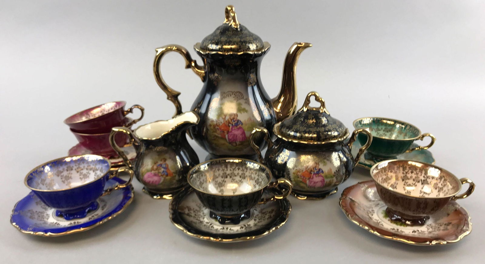 Vintage "Bavaria" Porcelain Tea Set: Teapot is 7 1/2 inches tall; set includes Teapot, tea cups,saucers, sugar and creamer. Cups are marked "Waldershof, Germany"