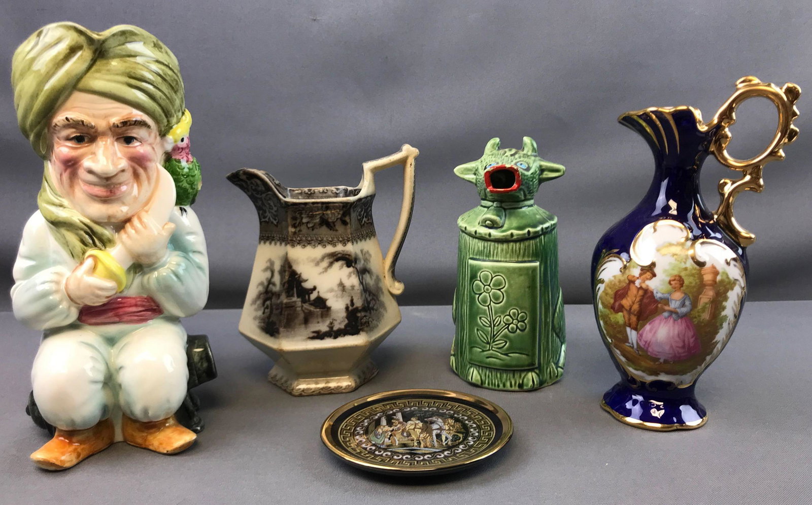 Group of Vintage Pitchers + more: Tallest measures 9 1/4 inches; Limoges, ironstone, and others. All of the pieces in this group have wear of some sort, scratches, chips, or cracks
