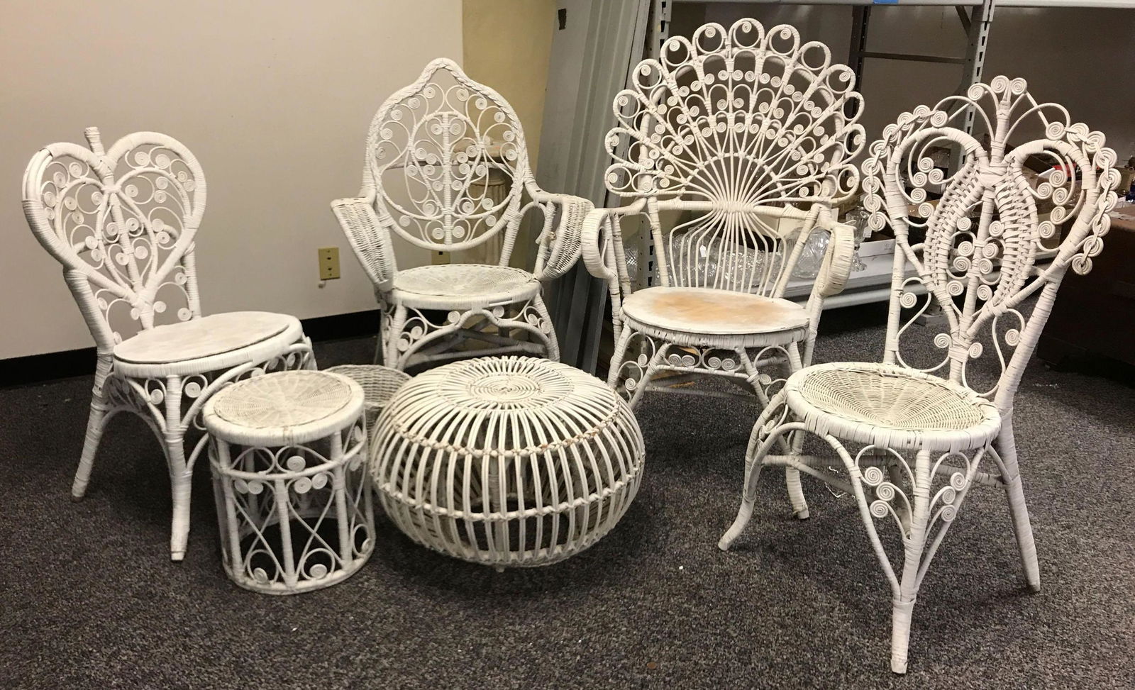 Group of Vintage Wicker Furniture: Largest chair is 44 inches tall; lot includes four chairs, wastebasket, and two side tables. All pieces have some minor wear or damage.Shipping is not available for this lot; pick up only