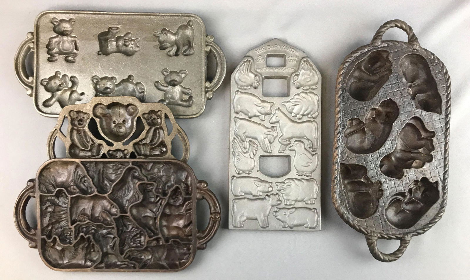 Group of 5 : Cast Iron Mold Pans: Largest is 15 1/2 inches long; teddy bears, farm animals, cats - some marked John Wright