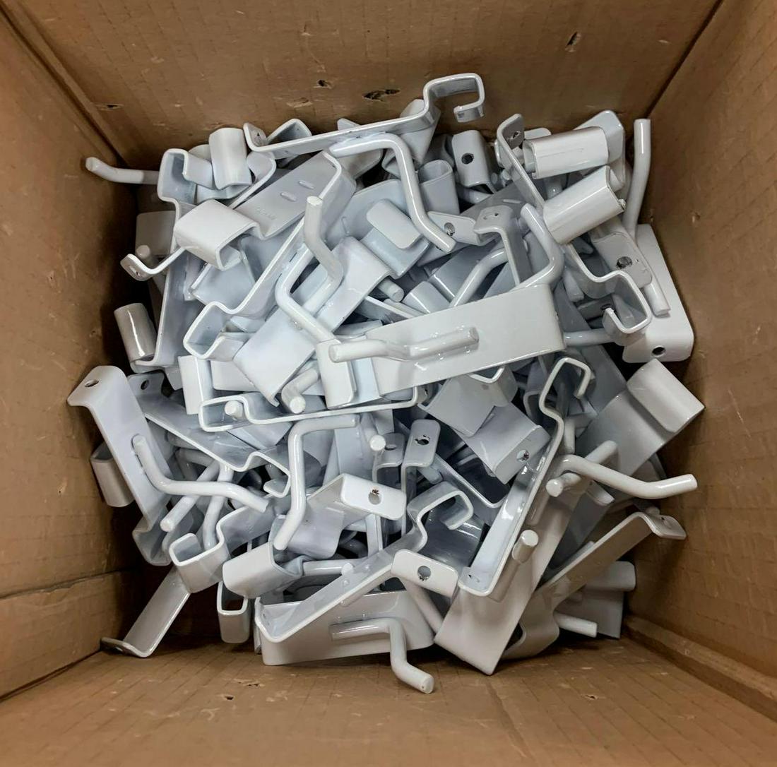 Group of 2 inch white grid wall hooks: Used condition