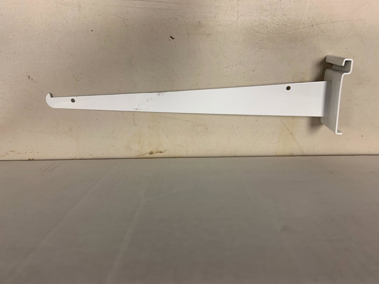 Group of 14 inch white grid wall shelf hooks: Approximately 20+