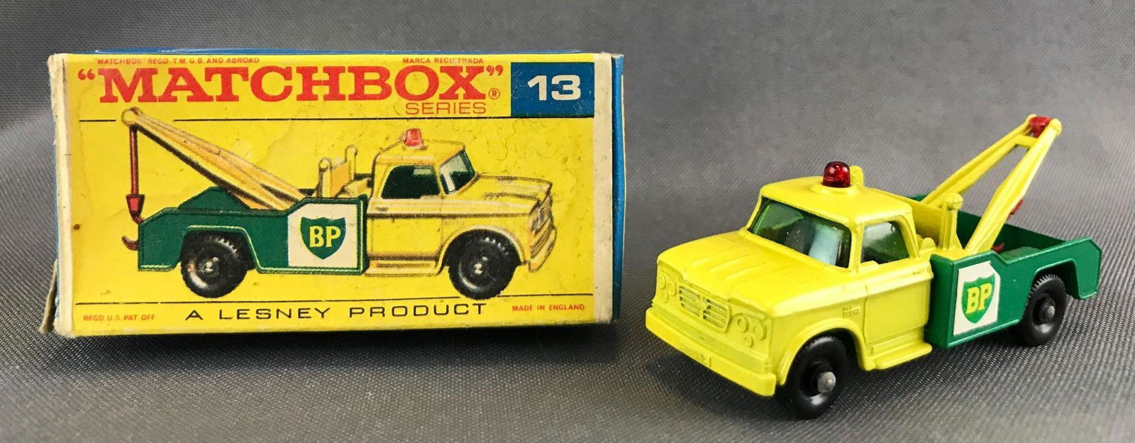 Matchbox No. 13 Dodge Wreck Truck Die-Cast Vehicle with: Yellow body, green base, blue/green windows, BPW, BP decals. Some box damage. A Lesney Product. Made in England