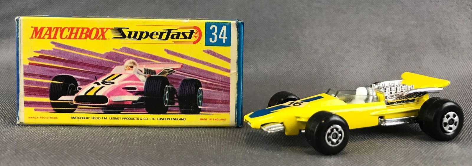 Matchbox Superfast No. 34 Formula 1 Racing Car Die-Cast: Yellow body, BPW, 16/blue arrow decal. Some box damage. A Lesney Product. Made in England