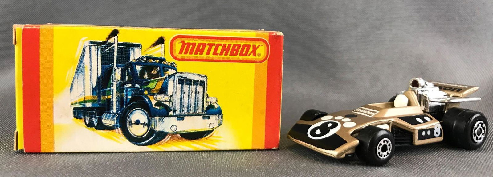 Matchbox No. 28 Formula 5000 Die-Cast Vehicle with: Gold body, BPW, 8/BFGoodrich/Exxon decals. A Lesney Product. Made in England