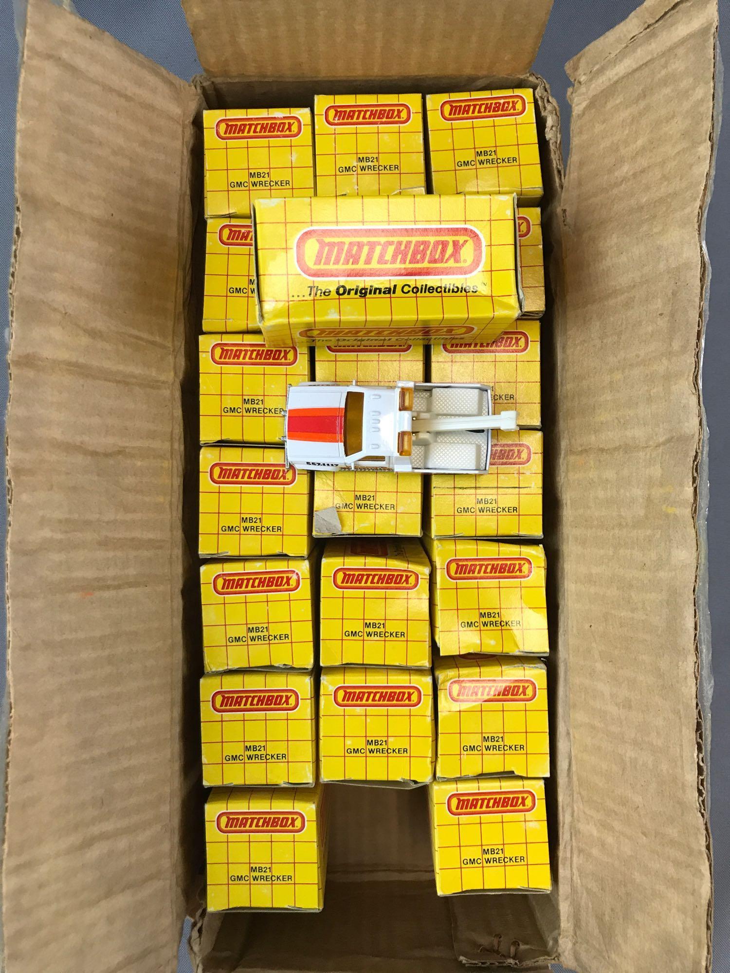 Group of 21 Matchbox No. MB21 GMC Wrecker Die-Cast: New in original packaging, some minor damage to some boxes
