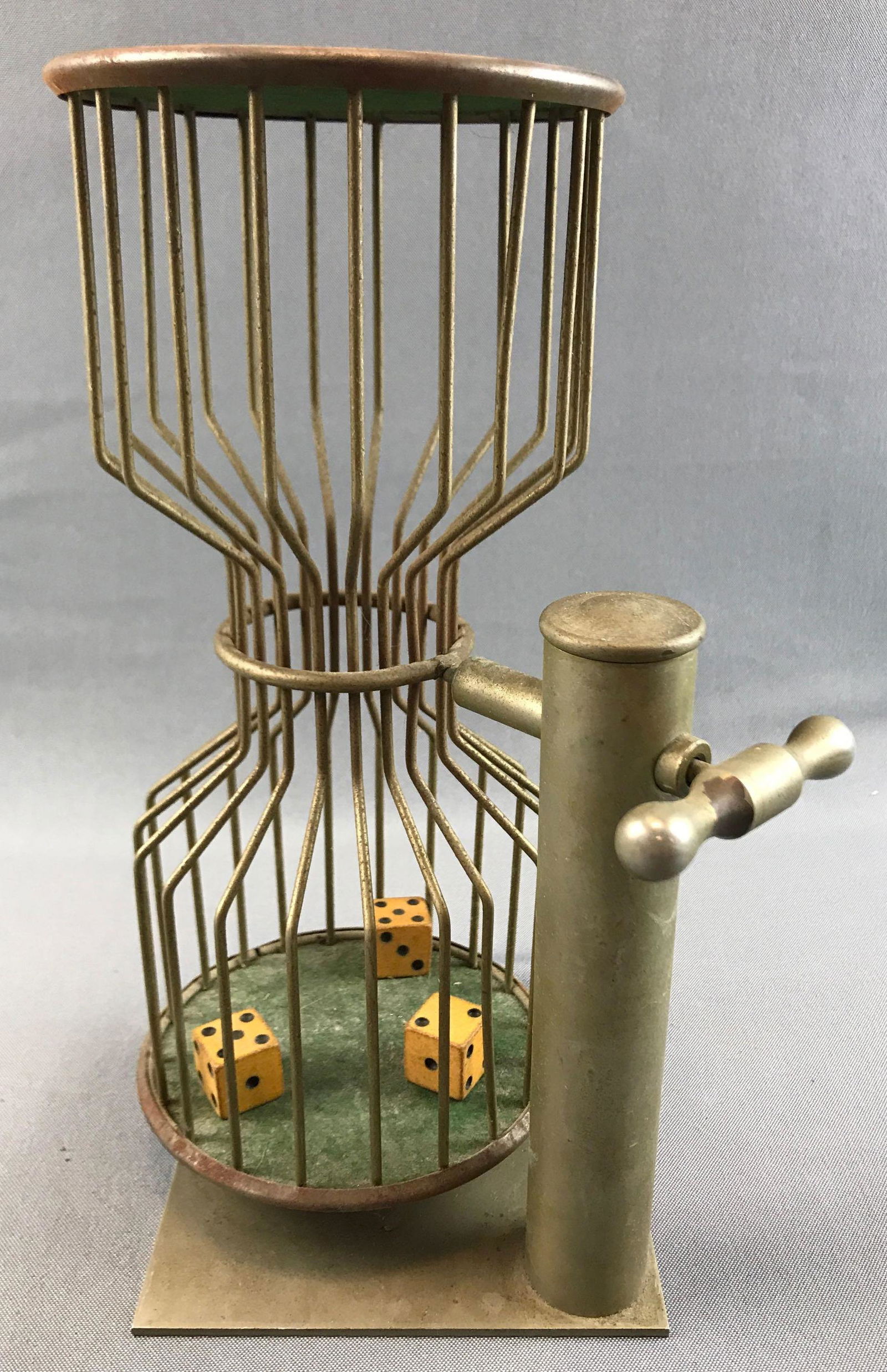 Vintage Chuck-A-Luck 3 Dice Shaker: 11 1/2 inches; handle flips the shaker over. Includes 3 dice - some rust and finish issues