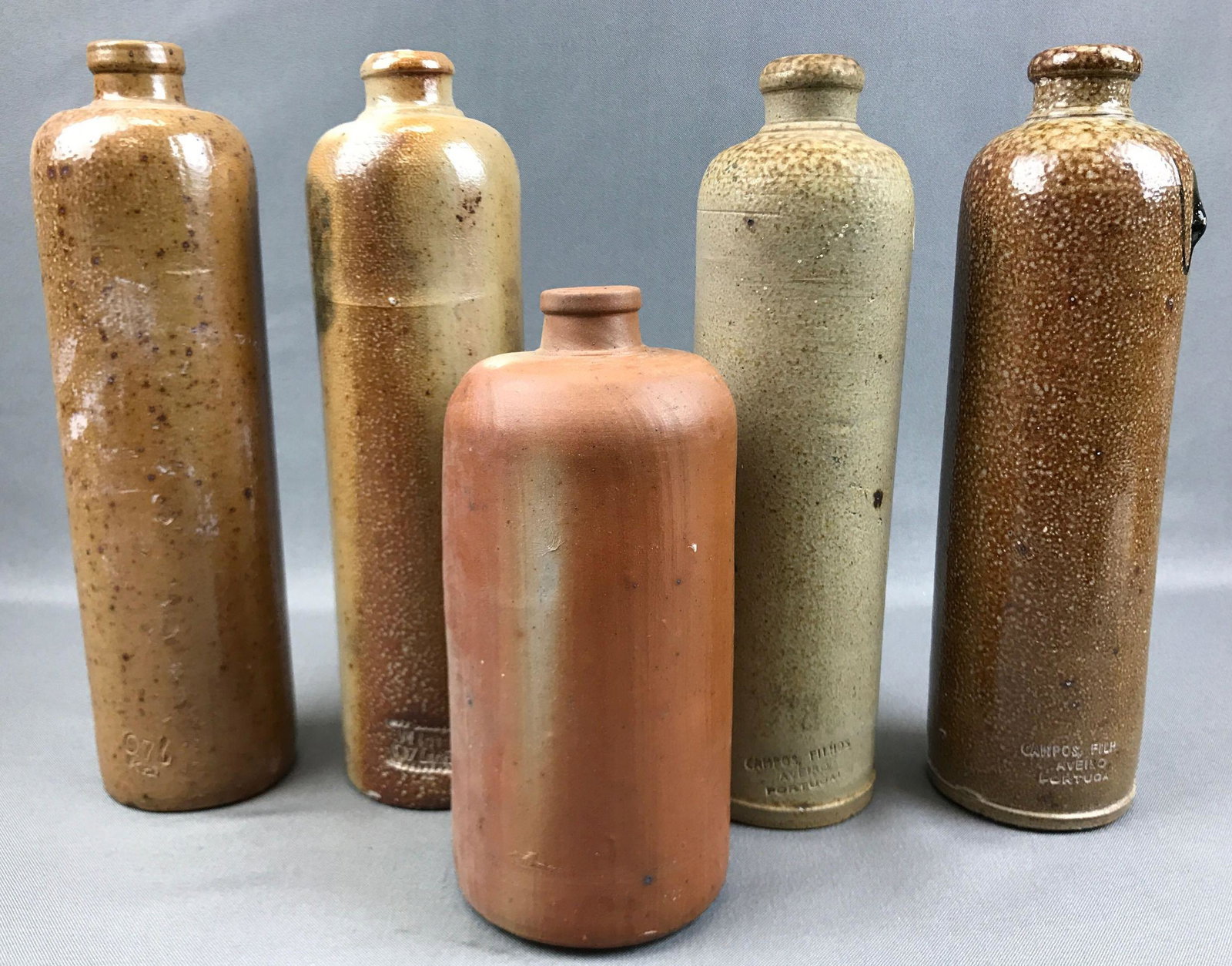 Group of 5 : Antique Stoneware Bottles: Tallest is 11 inches; Campos, Filhos, Aveiro Portugal and others