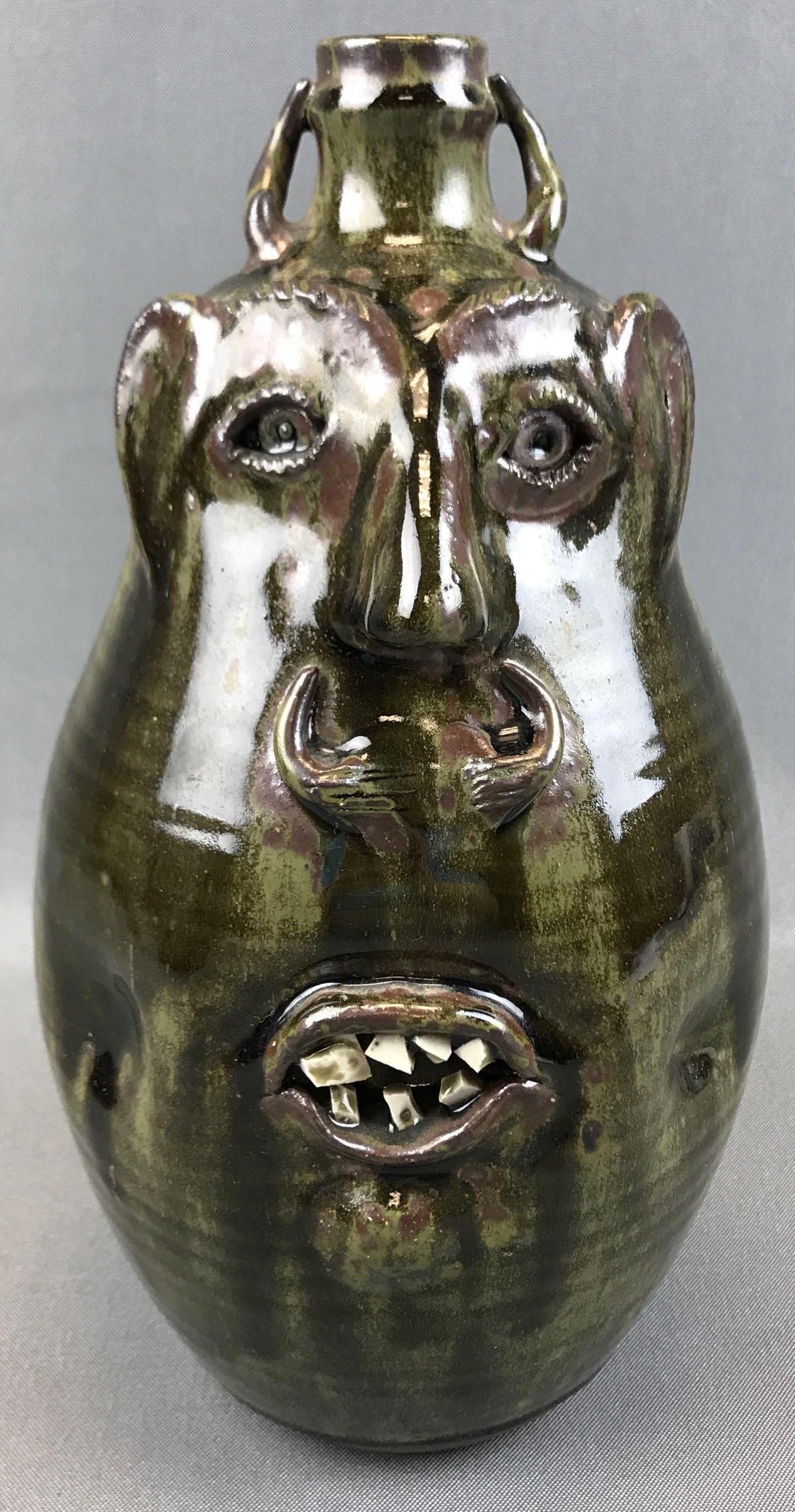 Robert Armfield : Artist Signed Pottery Face Jug: 10 1/2 inches tall; artist stamped "R. Armfield" and "Oakland Pottery" - green glazed watermelon shaped in very good condition w/o chips or repair