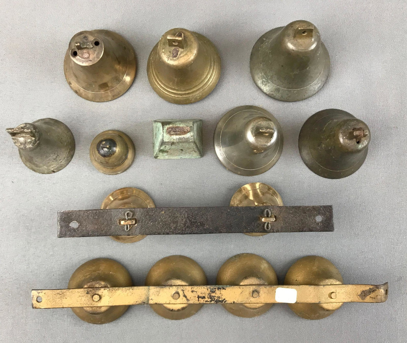 Group of Antique Bells: 2 sets are attached to metal bars - with a couple missing clappers. Largest antique bell is 3 inches tall