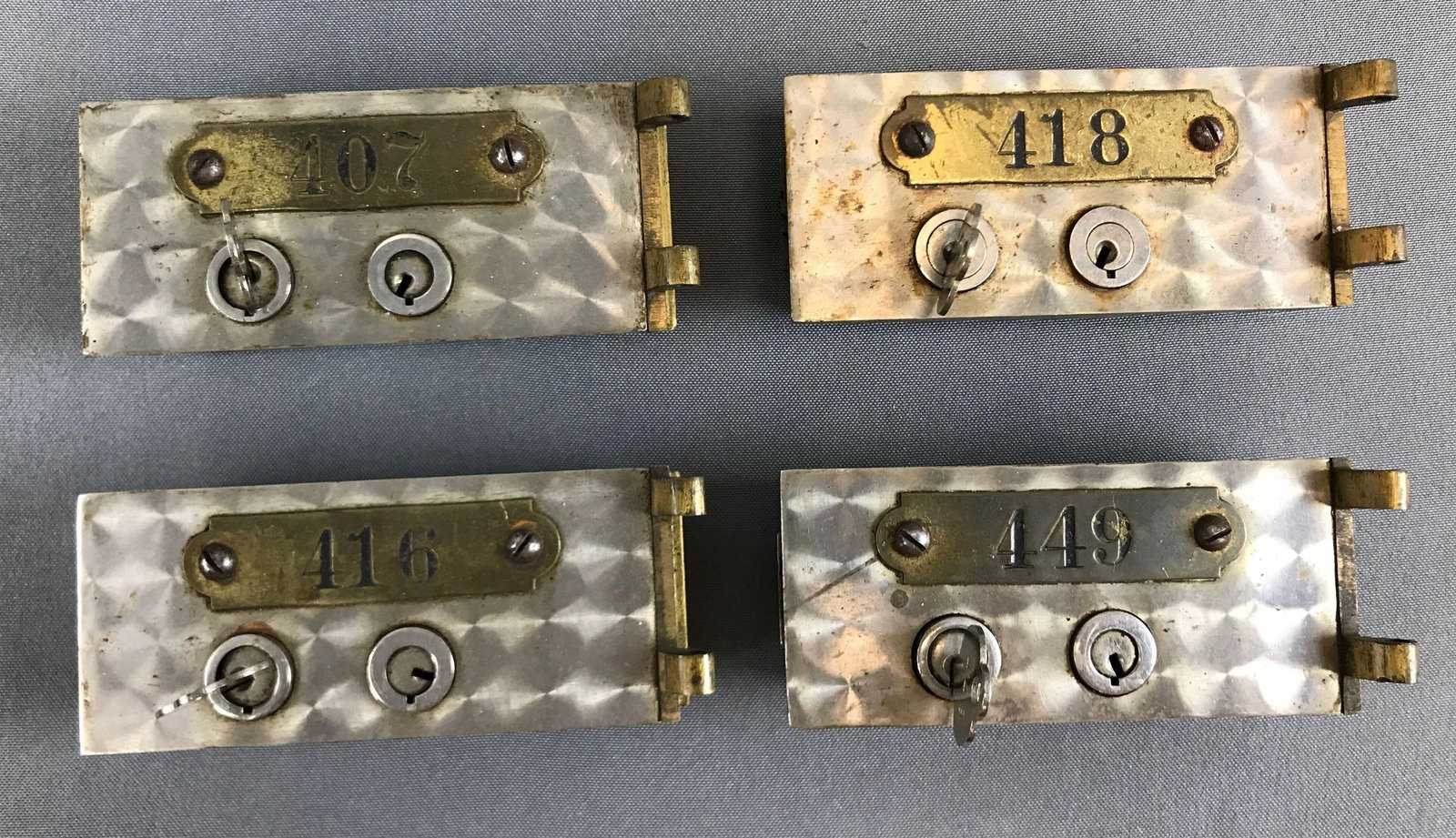 Group of 4 : Vintage Deposit Box Doors: 5 x 2 1/4 inches; brass number plates and hinges - each with a key