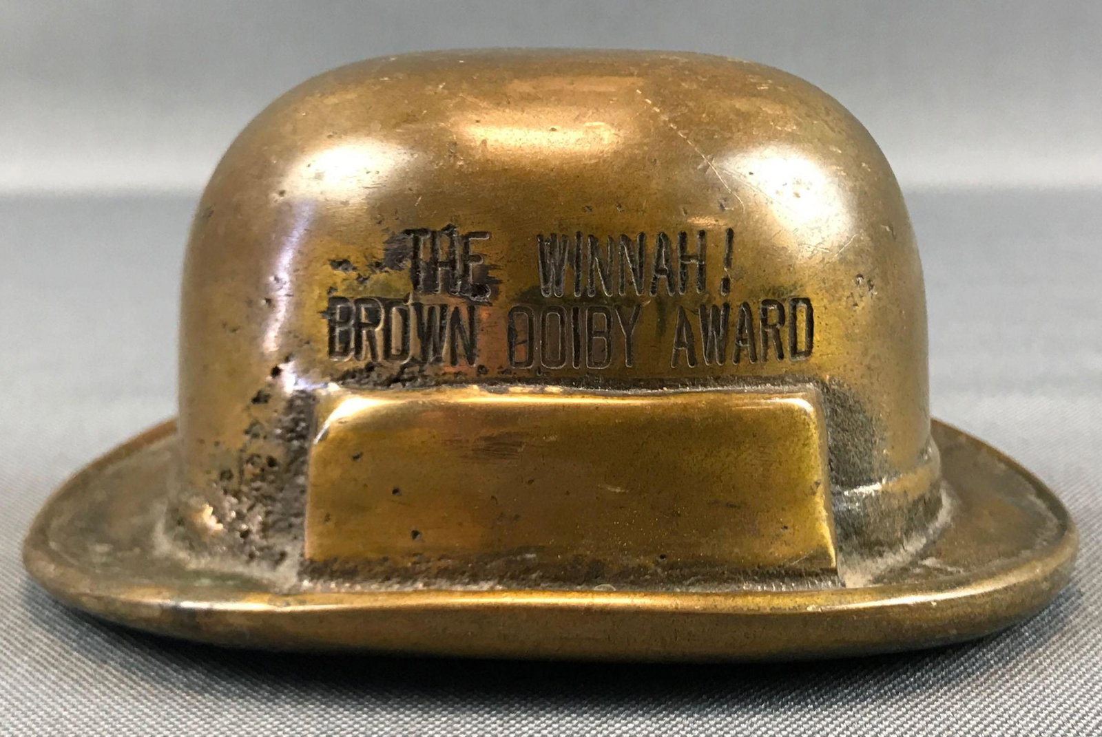 Vintage Brass "Brown Doiby Award" : Hat-shaped Trophy: 4 1/2 inches wide; "The winnah! Brown Doiby award" with "Britannica" on the back side