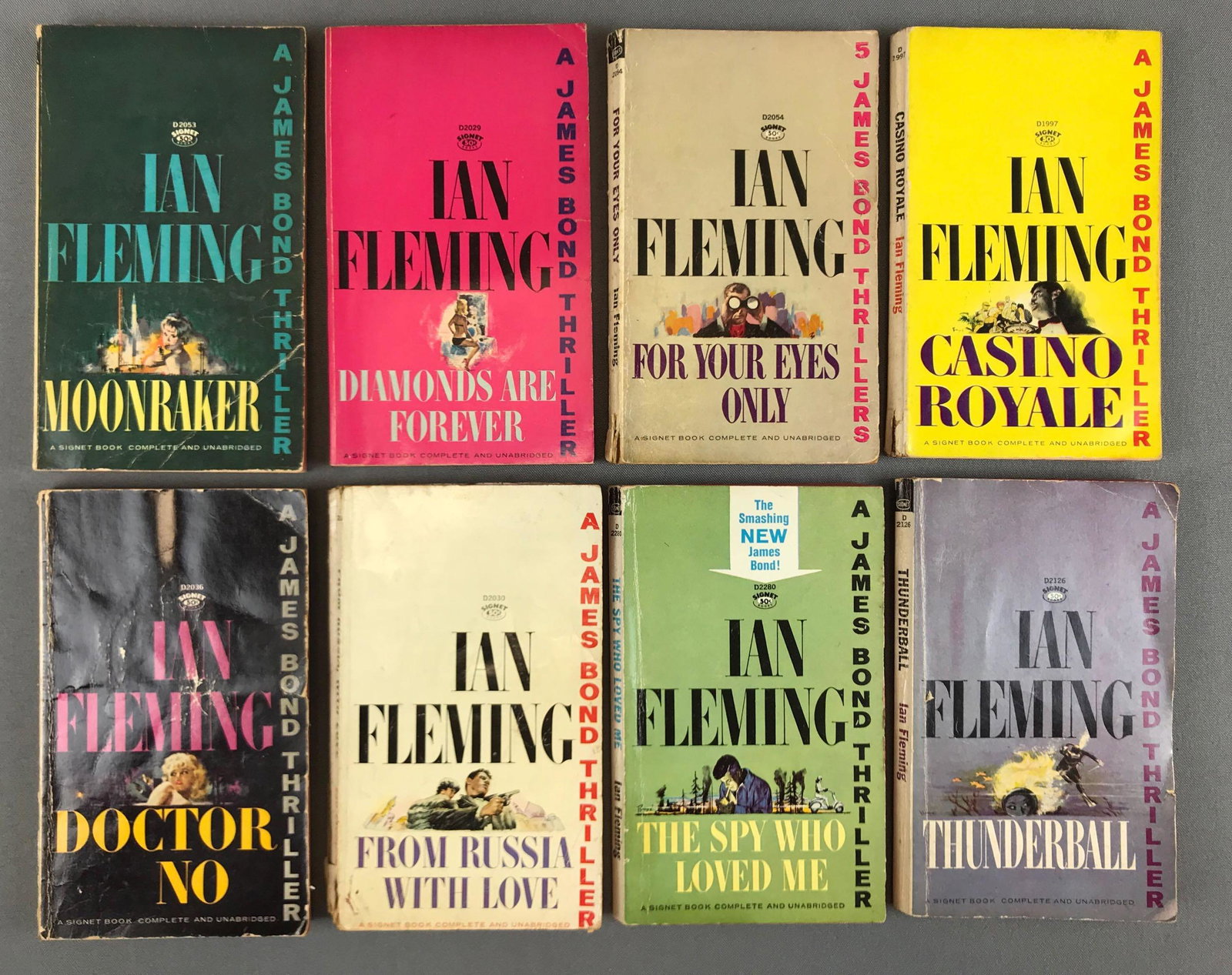 Group of 8 : Vintage Ian Fleming's James Bond Paperback: Lot includes :"Casino Royale", "The Spy Who Loved Me", "Doctor No", "Diamonds Are Forever", "Moonraker", "Thunderball", "For Your Eyes Only" and "From Russia With Love". Books are in used condition