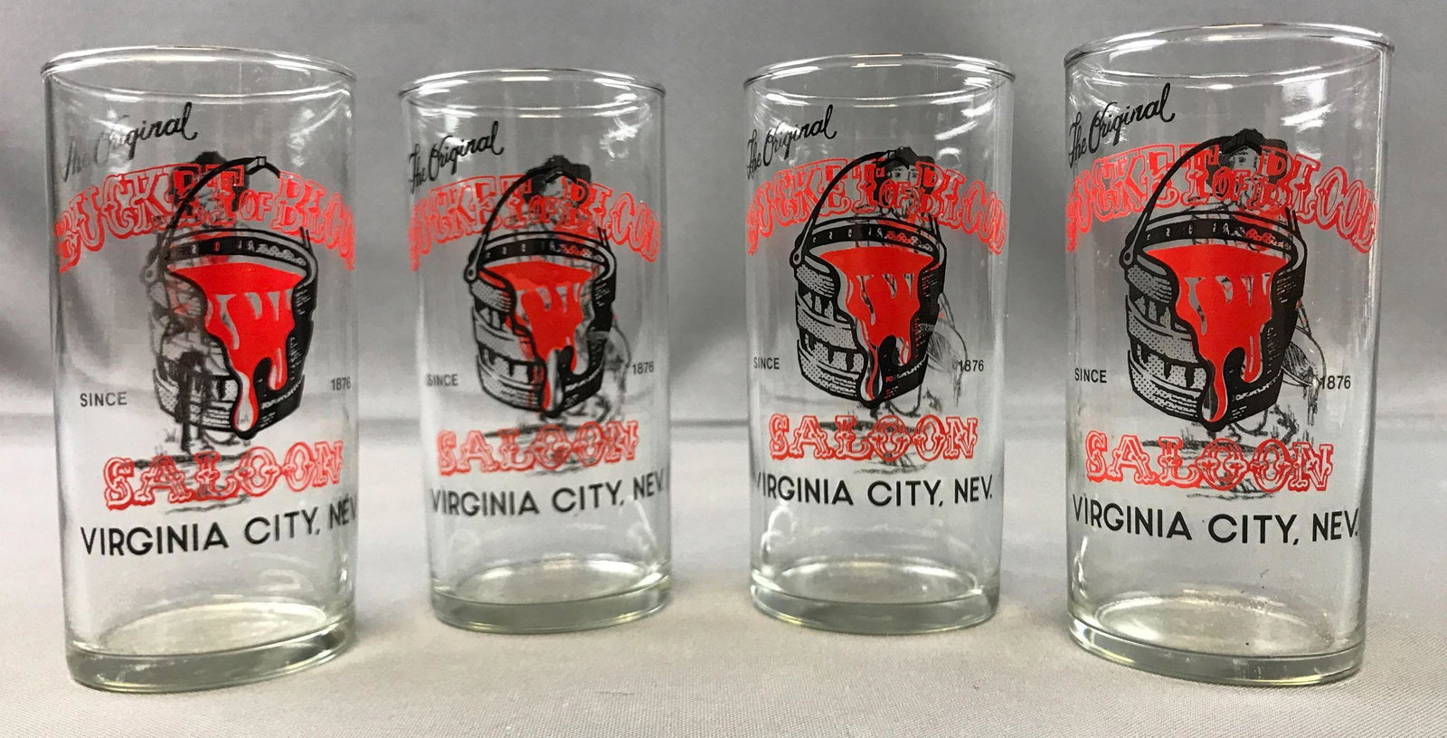 Group of 4 : Vintage "Bucket of Blood Saloon" Drinking: 4 1/2 inches tall; "Since 1876, Virginia City, NV." - one glass has design wear