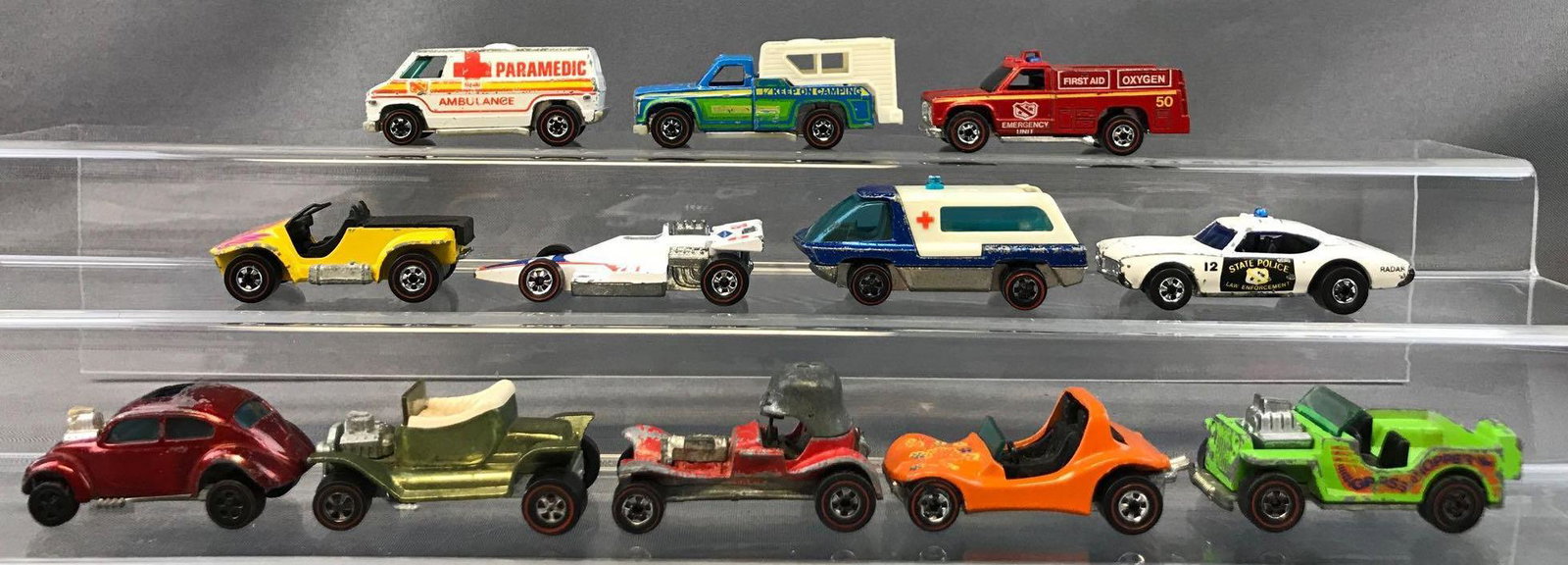 Group of 12 Hot Wheels Redlines Die-Cast Vehicles: 1967 Custom Volkswagen, 1969 Dune Daddy, 1974 Sand Drifter, and more