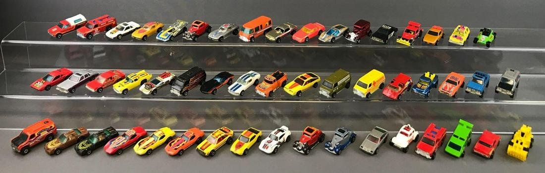 Group of 45+ Hot Wheels Die-Cast Vehicles circa: 1978 Upfront, 1982 Pontiac J2000, 1974 Large Charge, and more. Includes collectors case