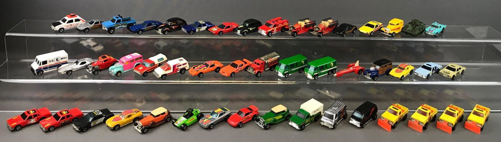 Group of 48 Hot Wheels Die-Cast Vehicles circa: 1980 Old Number 5, 1977 Racebait 308, 1978 Hare Splitter, and more. Includes collectors case