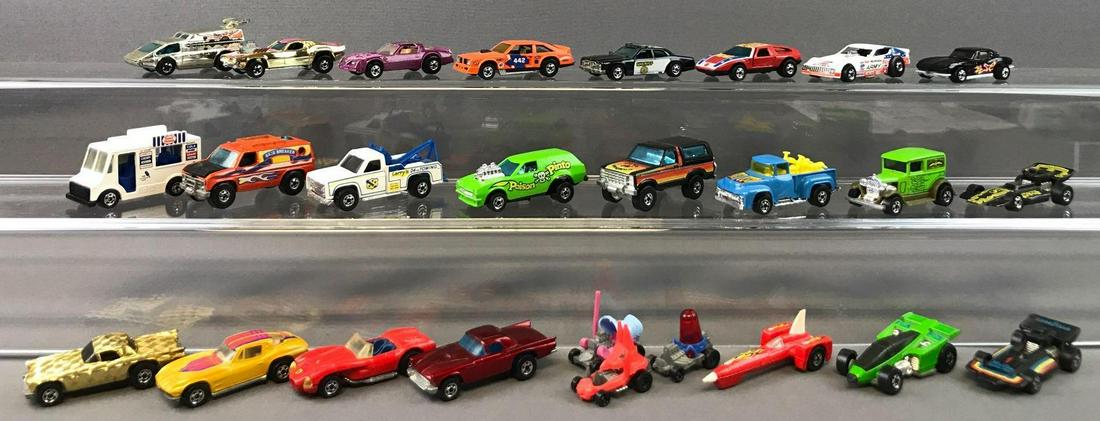 Group of 26 Hot Wheels Die-Cast Vehicles Circa: In Matchbox 24 car Carry Case. 1981 57 T-Bird, 1983 Good Humor Truck, 1976 Spoiler Sport, and more