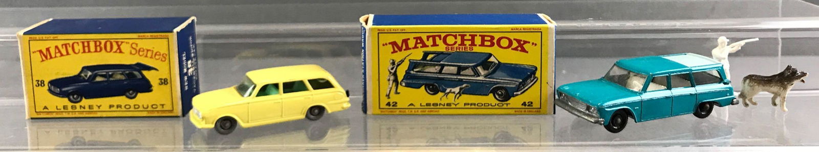 Group of 2 Matchbox die cast vehicles in original boxes: A Lesney Product. Includes no 38 Vauxhall Victor estate car, no 42 Studebaker station wagon. Both boxes have minor wear or damage.