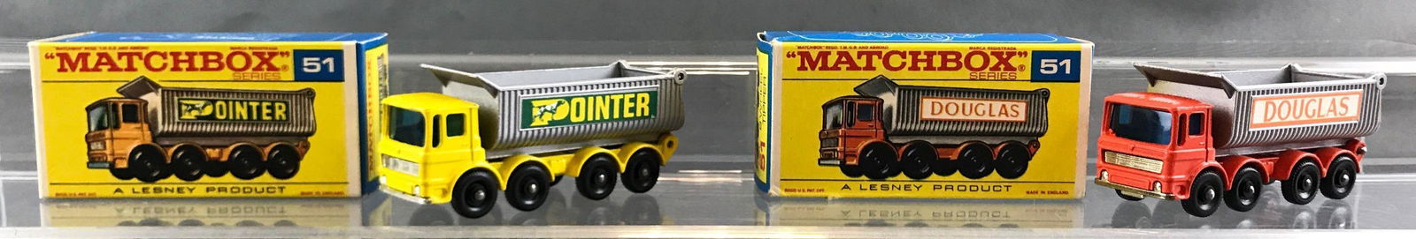 Group of 2 Matchbox die cast vehicles in original boxes: A Lesney Product. Both no 51 8-wheel tipper, Pointer, Douglas. Douglas box has a crease