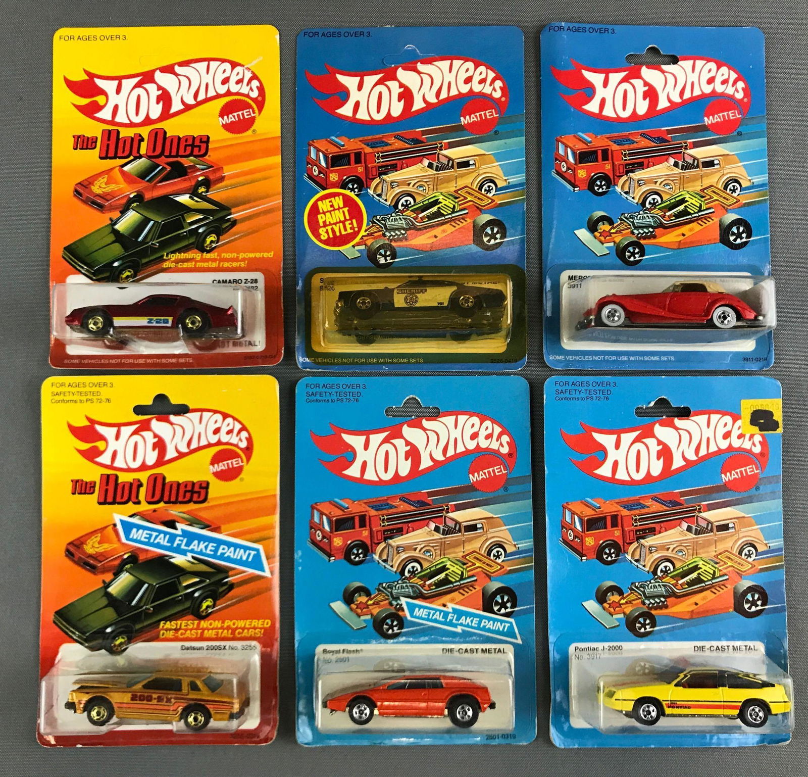 Group of 6 vintage Hot Wheels die cast vehicles in: Includes Camaro z28, sheriff patrol, Mercedes 540k and more