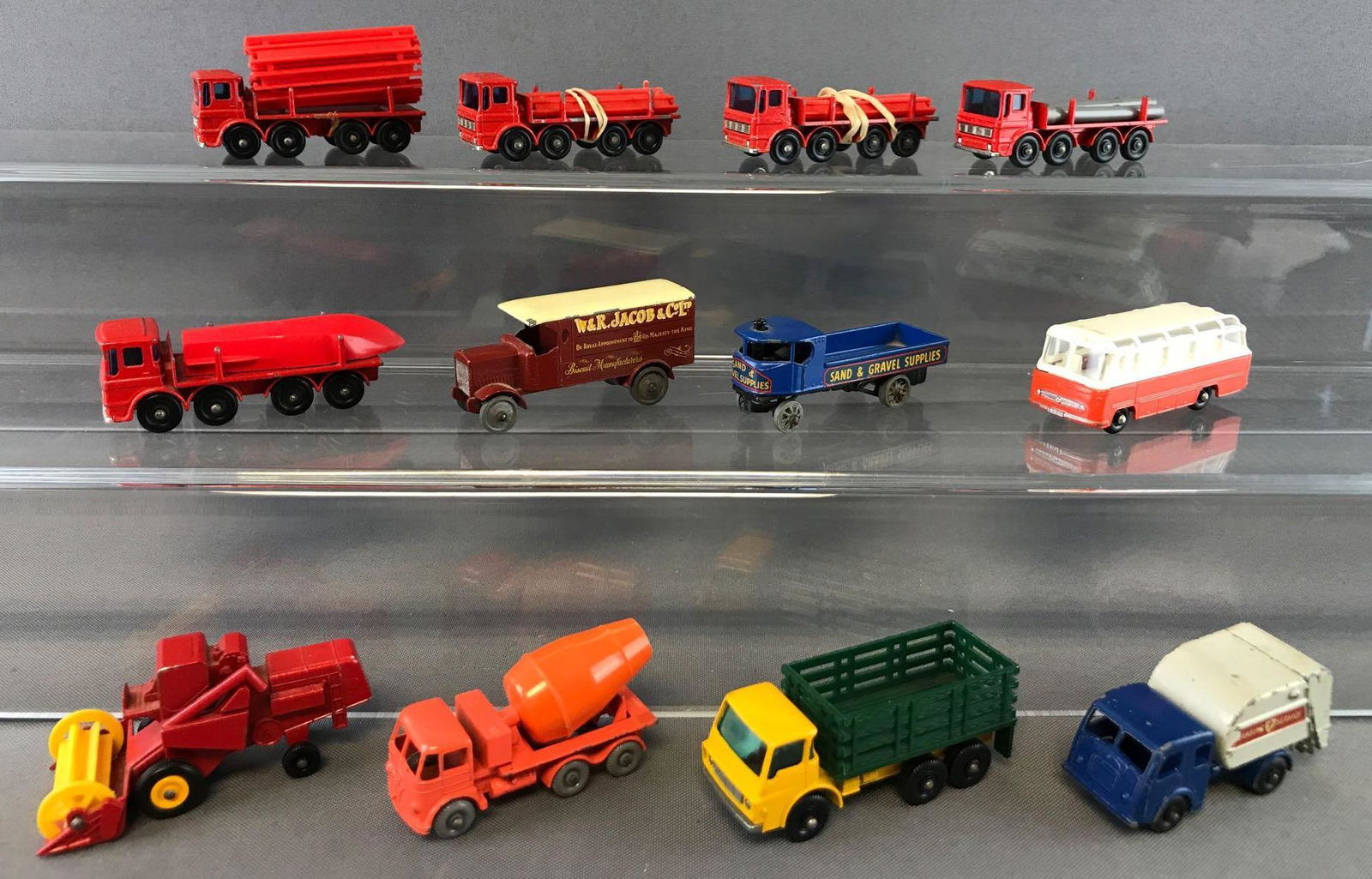 Group of 12 Matchbox Die-Cast Vehicles: Includes No. 65 Claas Combine Harvester, No. 68 Mercedes Coach, No. 15 Tippax Refuse Collector, and more. Also included-1970 Matchbox Superfast Collectors Mini-Case