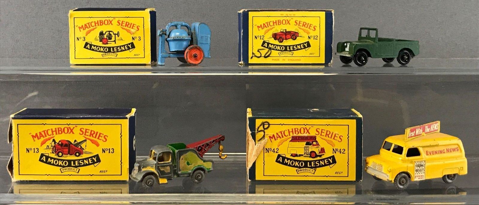 Group of 4 Matchbox Die-Cast Vehicles with Original: No. 13 Wreck Truck, No. 42 Evening News Van, No. 12 Land Rover Series II, and No. 3 Cement Mixer. All boxes damaged. A Moko Lesney Product. Made in England