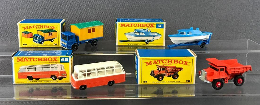 Group of 4 Matchbox Die-Cast Vehicles with Original: Includes No. 68 Mercedes Coach, No. 28 Mack Dump Truck, No. 9 Boat and Trailer, and No. 60 Truck with Site Office