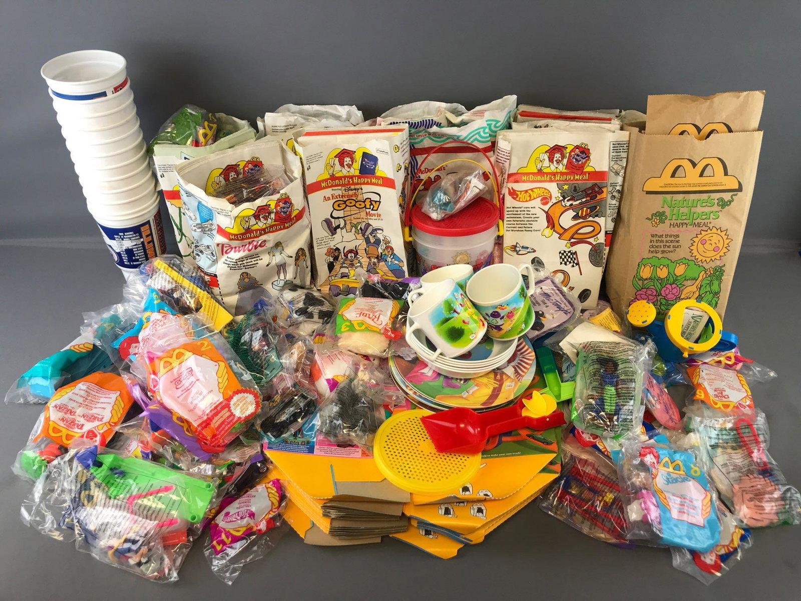 Group of 100+ McDonalds Happy Meal Toys, bags, and more: Barbie/Hot Wheels, Babe, Tarzan, and more