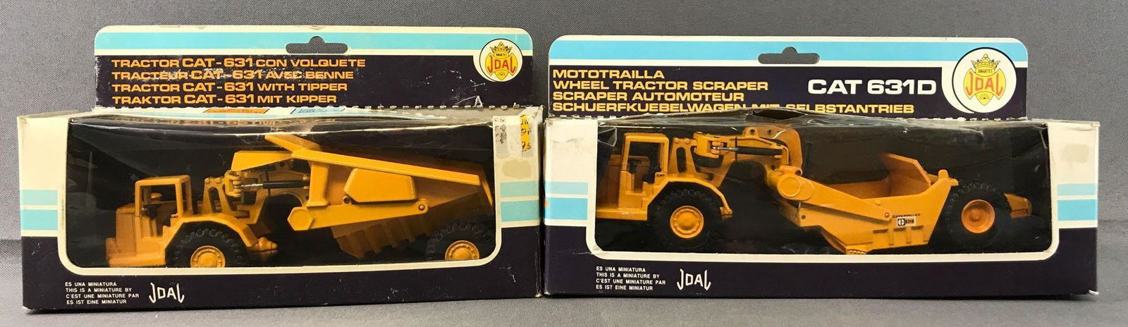 Group of 2 Joal Die-Cast Vehicles in Original Packaging: Includes No. 222 Caterpillar Tractor-631 with Tipper and No. 219 Caterpillar 631D