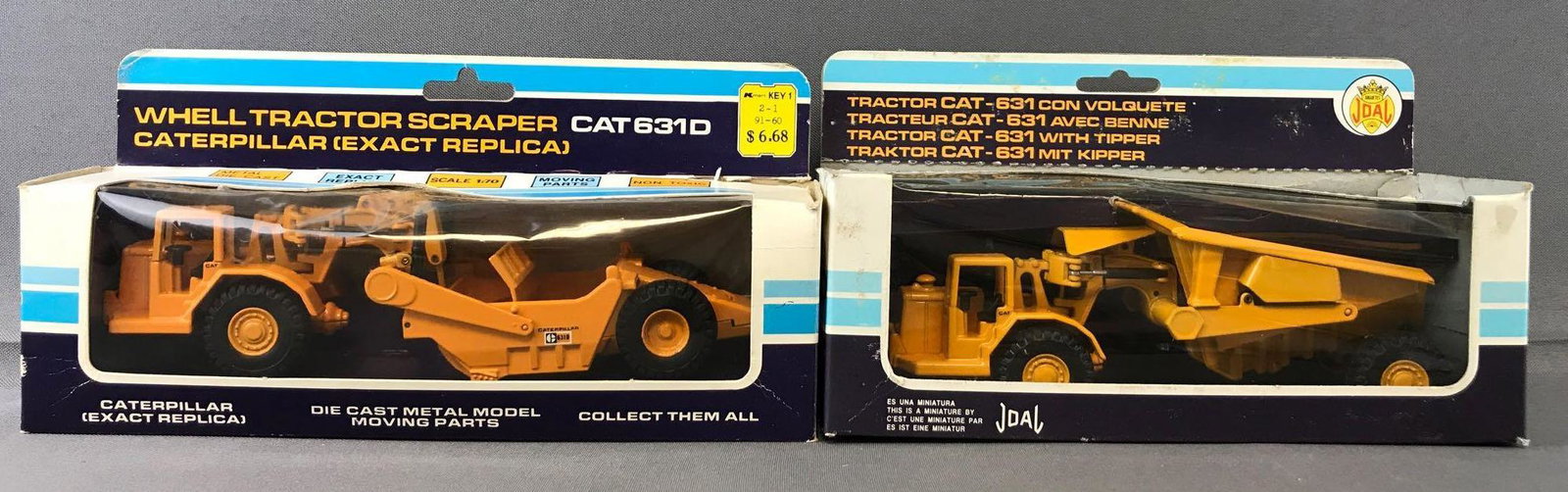 Group of 2 Joal Die-Cast Vehicles in Original Packaging: Includes No. 219 Caterpillar 631D Tractor and No. 222 Caterpillar 631 Tractor with Tipper. Some damage to packaging