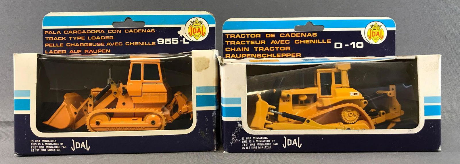 Group of 2 Joal Die-Cast Vehicles in Original Packaging: Includes No. 213 Caterpillar 954-L Track Type Loader and No. 220 Caterpillar D-10 Chain Tractor