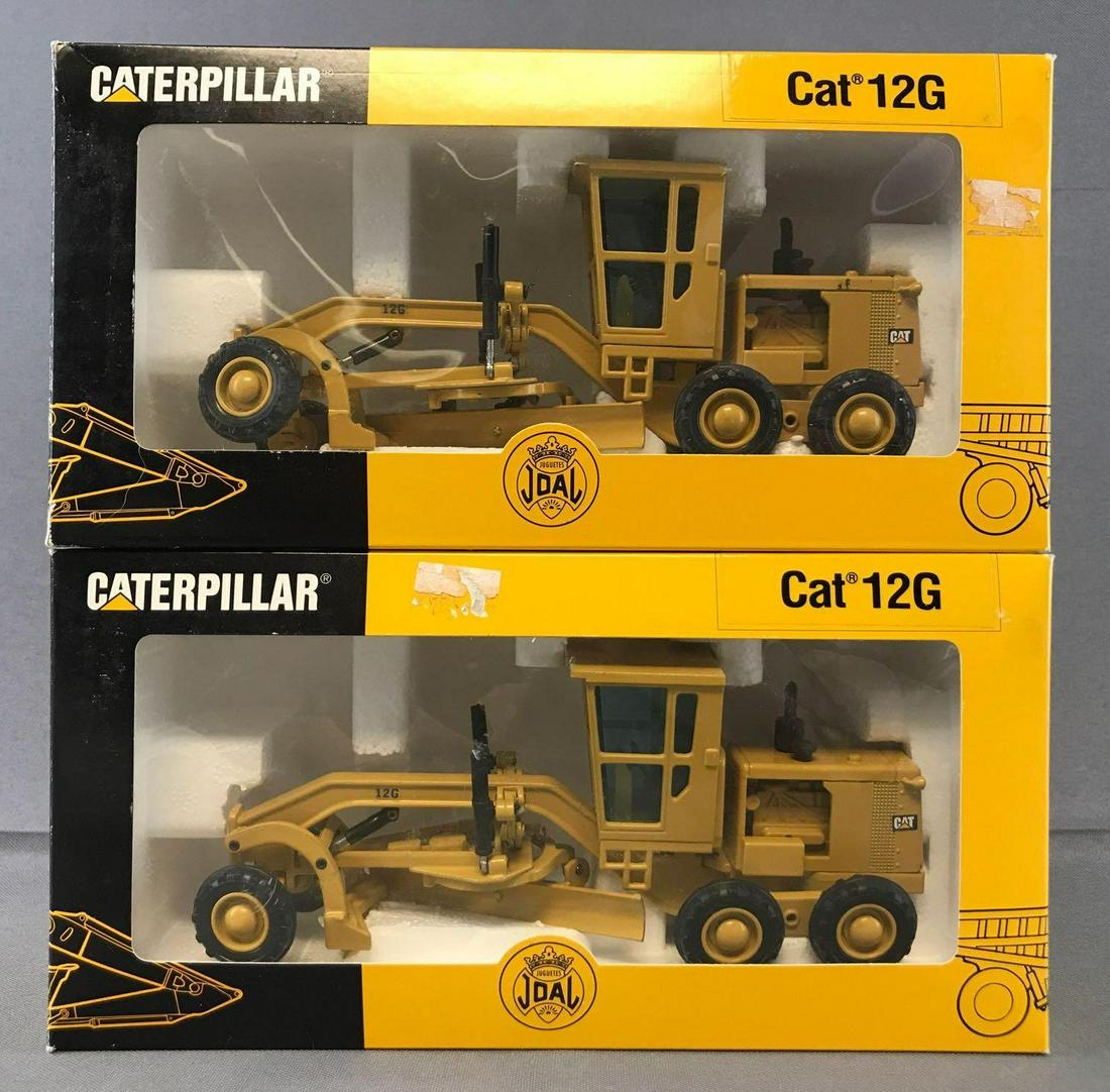 Group of 2 Joal No. 217 Cat 12G Motor Grader Die-Cast: New in original packaging, some damage to packaging