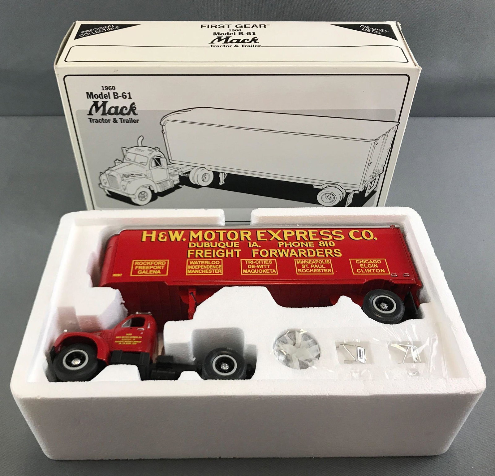 First Gear H&W Motor Express die cast truck in original: 1/34 scale, 1960 Model B-61 Mack tractor and trailer. Box has some minor damage.
