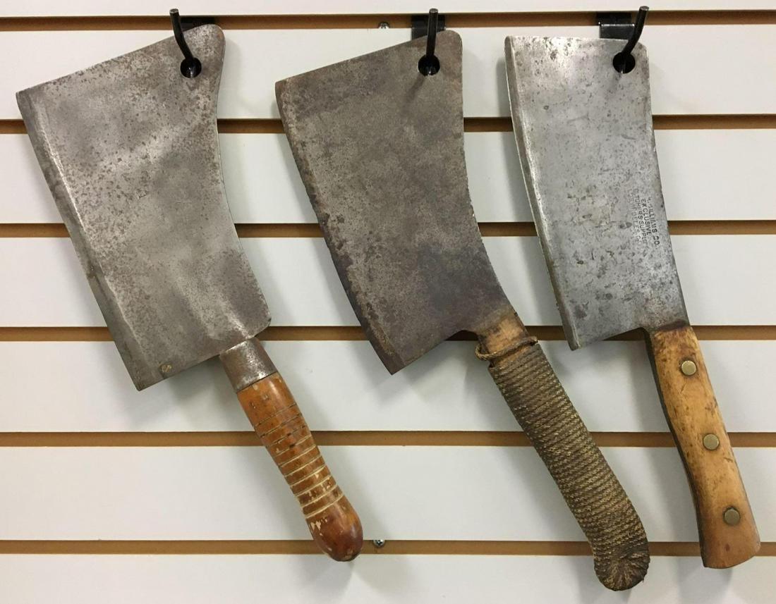 Group of 3 Antique Butcher Knives/Meat Cleavers -: Largest is 17 inches long with a 9 inch blade; smallest is 16 inches long with a 9 inch blade - the overwrapping on one of the handles has begun to unroll