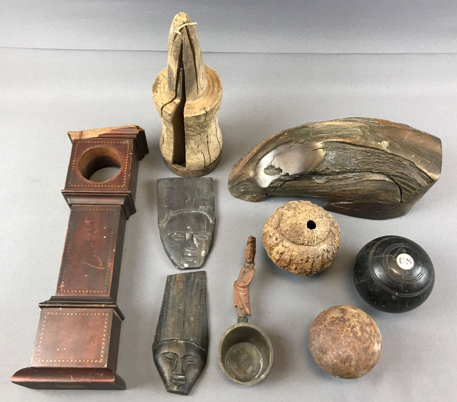 Group of Antique and Vintage Items: Carved faces, cast iron ball and more