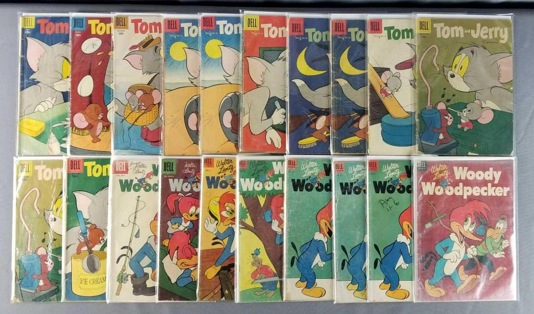 Group of 20 Dell Comics silver age comic books: Tom and Jerry and Woody Woodpecker. Some have writing or scribbles. Bagged and boarded