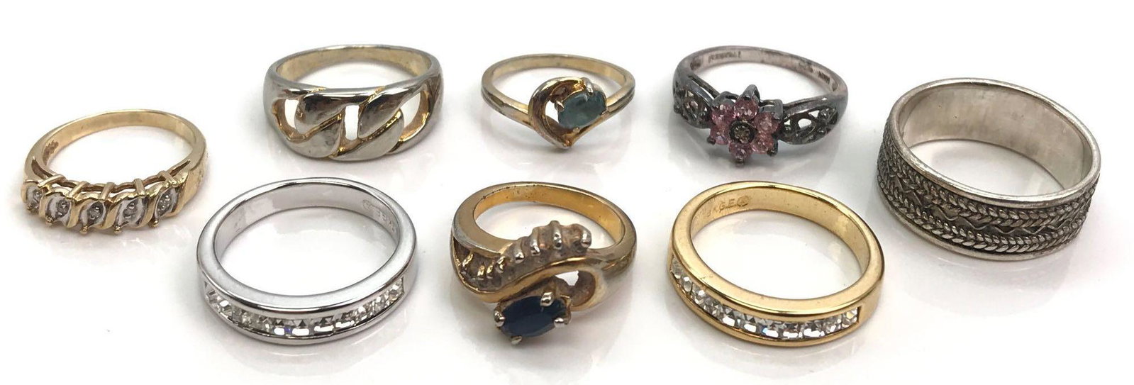 Fashion Costume Ring Lot: Lot contains eight costume rings in assorted sizes and features a size 4.25 illusion set diamond band and plenty of crystal sparkle