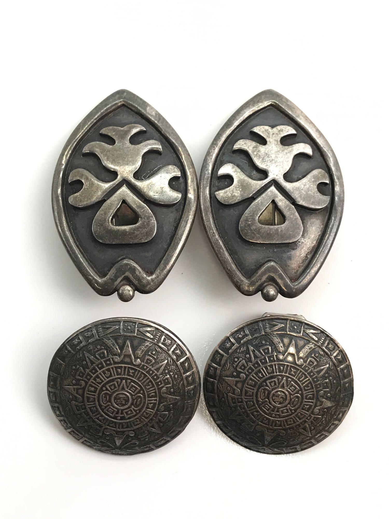 Lot of 2 Pairs : Vintage Sterling Silver Clip-on: The larger 1 1/2 x 1 inch oval pair of vintage sterling silver earrings is marked #1020 "JLF" (Jose Luis Flores) and "Miguel"; the 1 x 1 inch round sterling silver earrings carry a crown hallmark. - 2