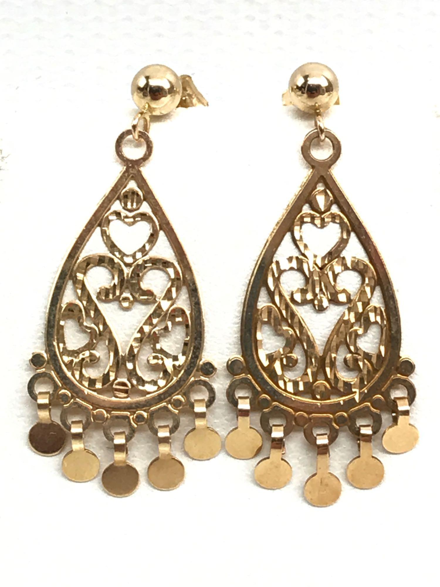 14k Yellow Gold Earrings - Michael Anthony: 14k yellow gold earrings are hallmarked for "Michael Anthony Jewelry", measure 1 1/4 x 1/2 inch, and feature an attractive openwork field with small bottom edge "floating coin" accents - 1.5g