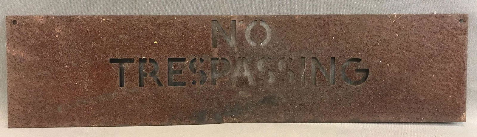 Metal "No Trespassing" Sign: 23 3/4 x 5 3/4 inches - very weathered, rusty