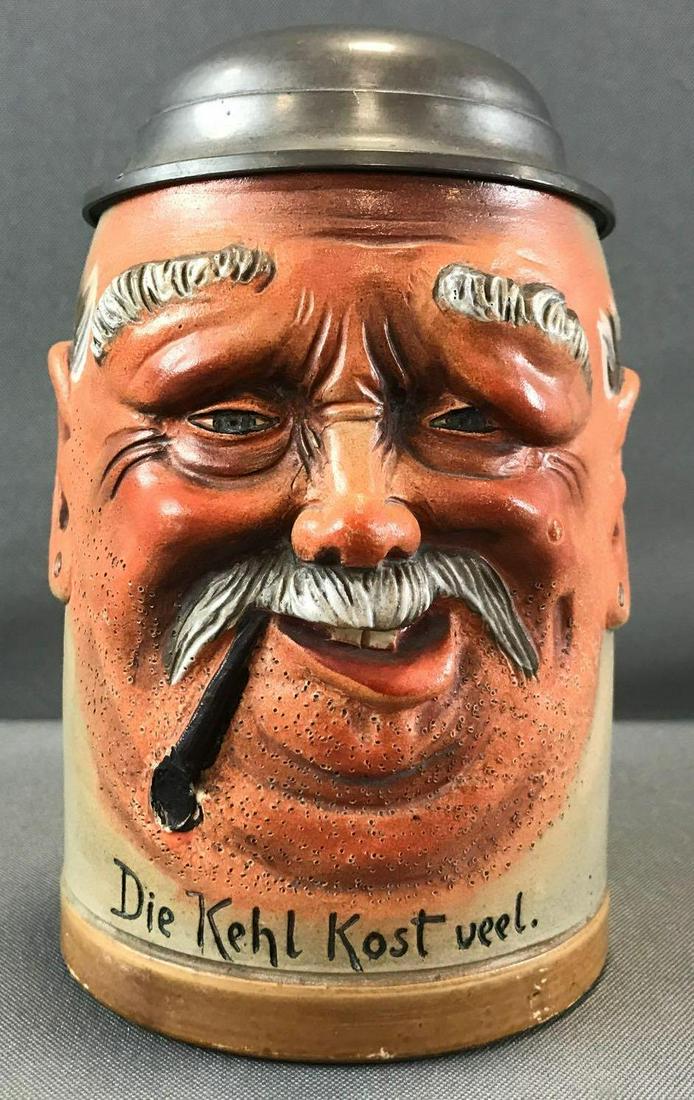 Antique Lidded Character Beer Stein: "Man with Pipe": Antique Lidded Character Beer Stein: "Man with Pipe" Die Kehl kost viel. (aka A (dry) throat is expensive)3.75 inch bottom, 6 1/2 inches tall