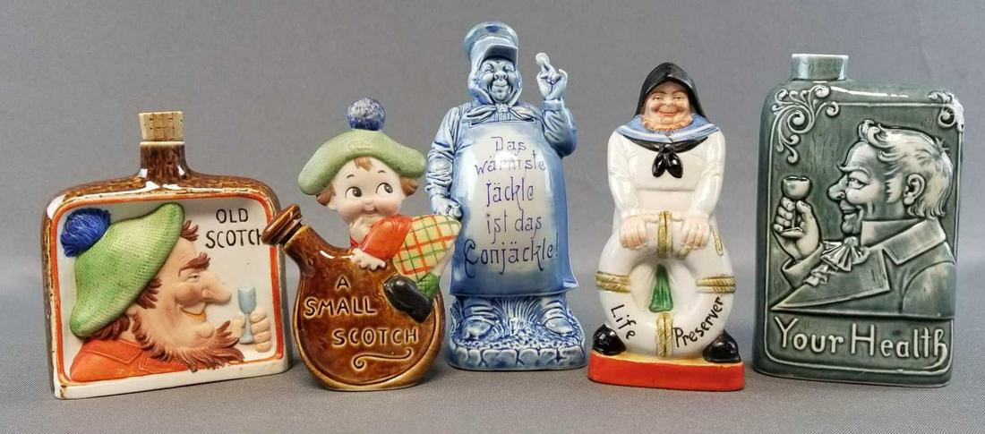 Group of 5: Antique Schafer and Vater Porcelain Flasks: Tallest flask measures 6 1/4 inches. Lot includes OldScotch, Small Scotch, Your Health, Life Preserver, and Blue Glazed Nipper
