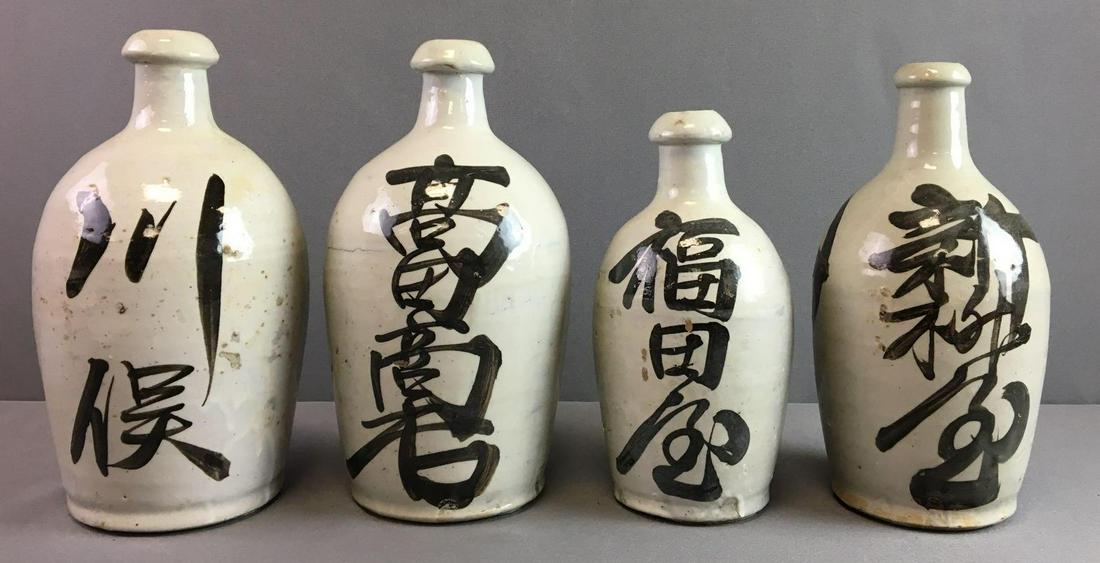 Group of 4 : Vintage Stoneware Bottles with Japanese: Largest is 10 1/2 inches tall