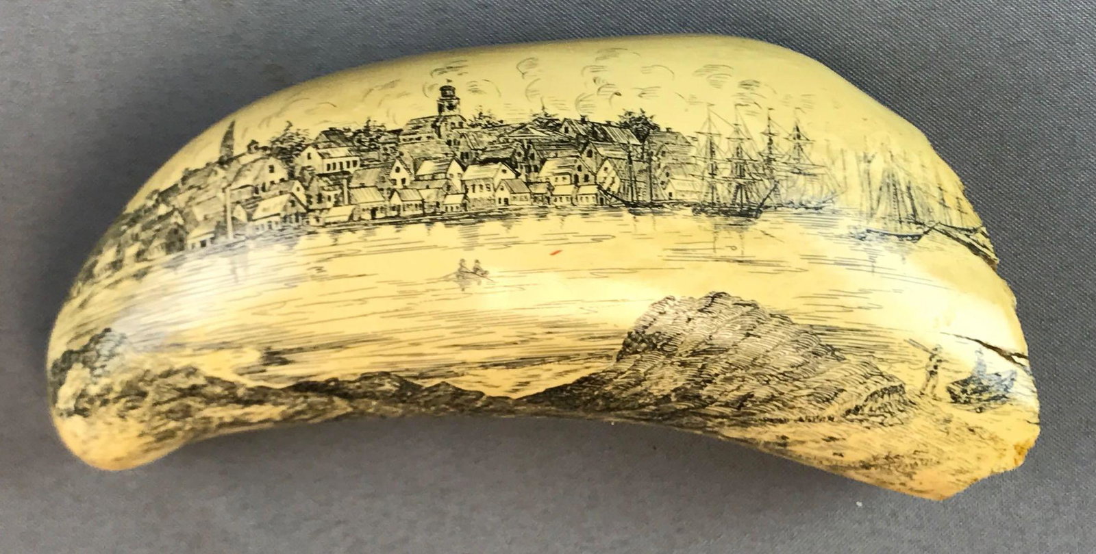 Vintage Scrimshaw: Nantucket Whaling Museum (Artek: Nantucket Whaling Museum (Artek reproduction) Whale Tooth measures 8 inches and features an 1853 view of Nantucket, Massachusetts
