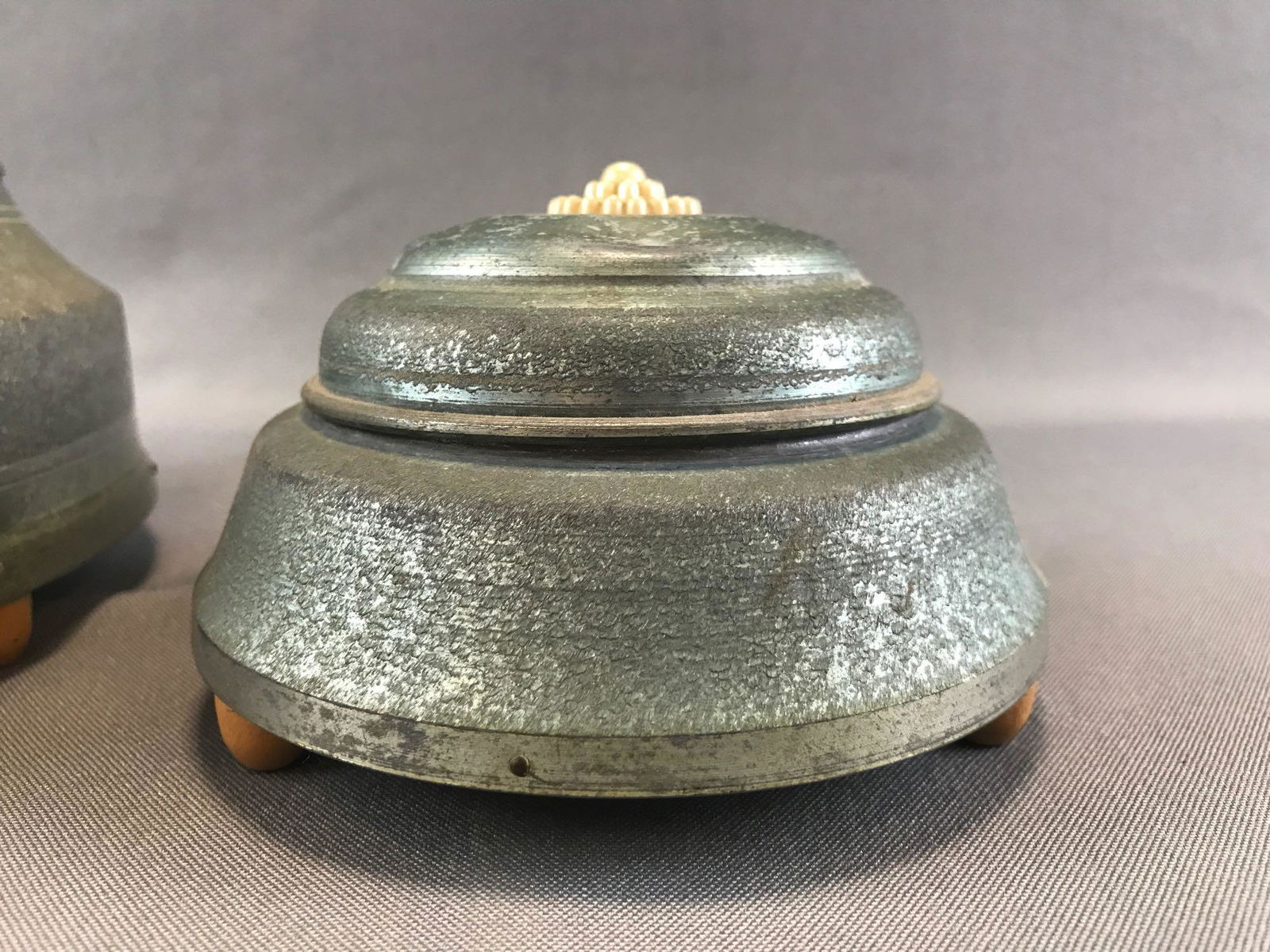 Group of 2: Vintage Metal Musical Powder Puff/Trinket: Both boxes are in working condition. Larger musical trinket box is approximately 9 x 5 inches and has a sectioned insert