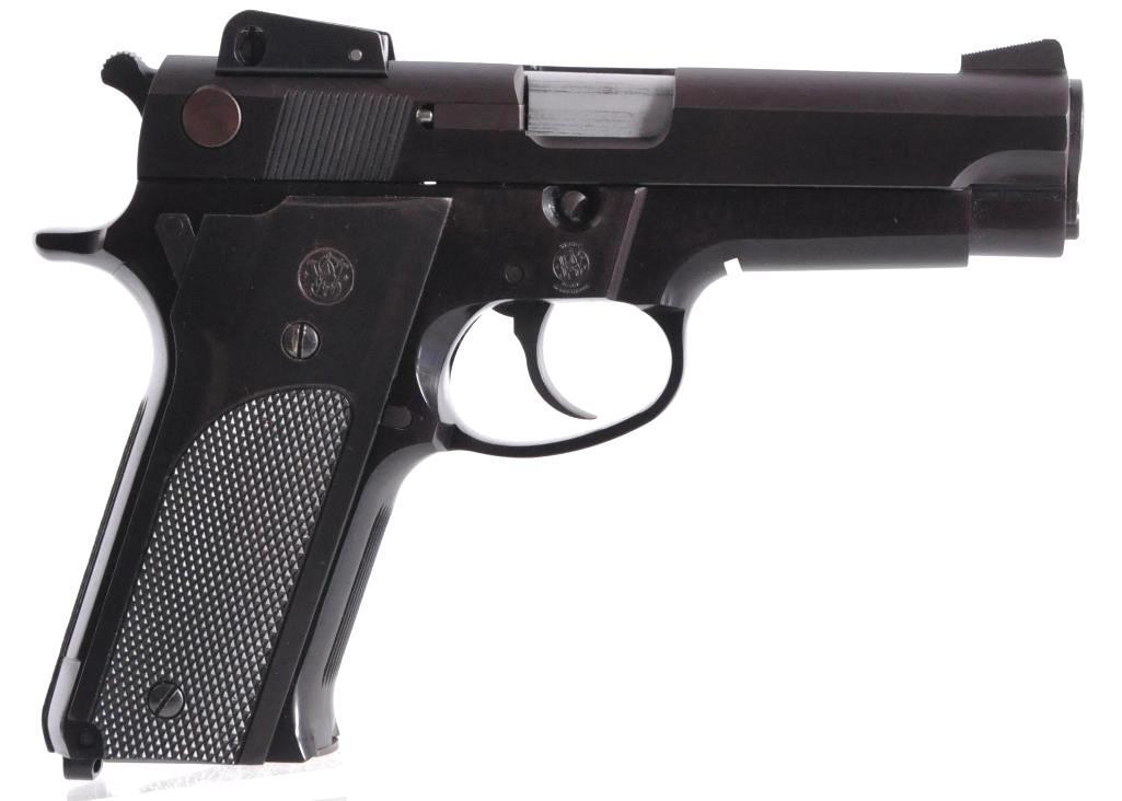 Smith and Wesson Model 459 9mm Semi Auto Pistol with: Serial Number A734009, S&W model 459 Semi Auto Handgun w/checkered black nylon grips, 2 magazines marked S&W, 4 inch barrel, 9mm cal., Adjustable sight, DA & SA, Manufactured from 1984 to 1988, like n