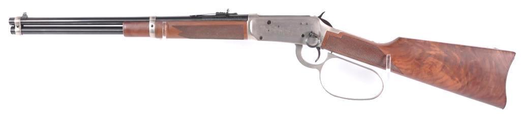 Winchester Model 94 1981 John Wayne Commemorative 32-40: Serial Number JW18380, 1981 John Wayne Commemorative, Caliber 32-40 with large loop lever, leather thong and saddle ring, hang tag with original box. Includes leather JW Commemorative scabbard. (has s