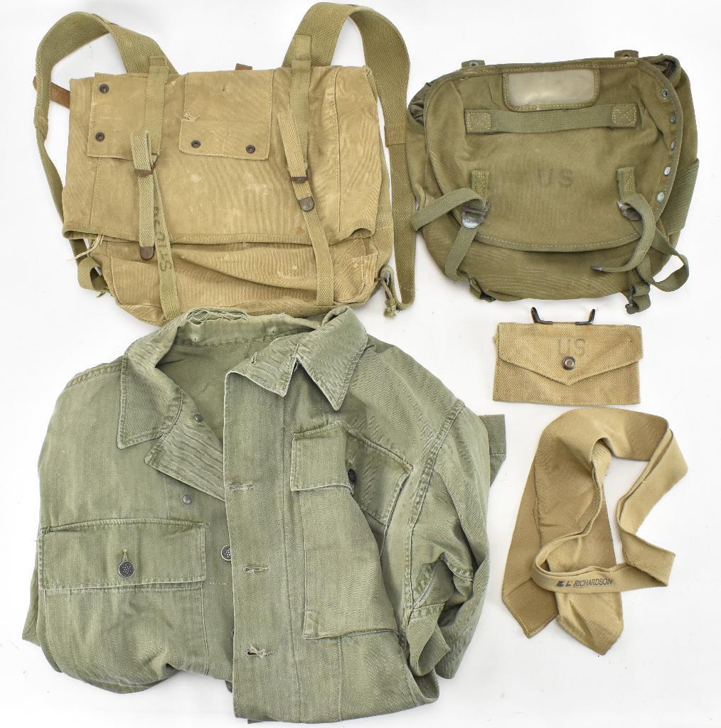 Group of WW2 and Vietnam Era Items: Includes WW2 US Marine Corps pack by BOYT 1944, Vietnam era butt pack, WW2 leather pack tail strap, WW2 well used HBT shirt, WW2 tie, and WW2 British made first aid pouch.